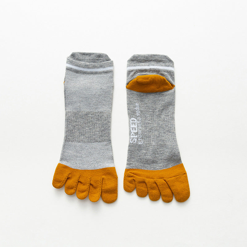 Pair of gray toe-separated socks with yellow toes on a white background