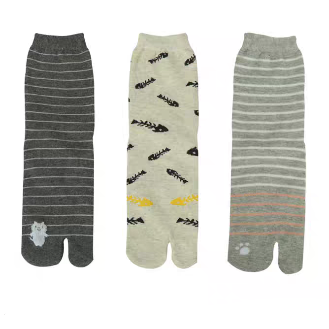 Three pairs of socks with different patterns on a white background