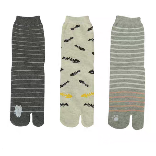 Three pairs of socks with different patterns on a white background