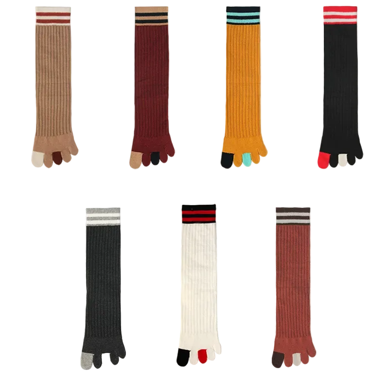 Set of colorful five-toe socks displayed against a white background