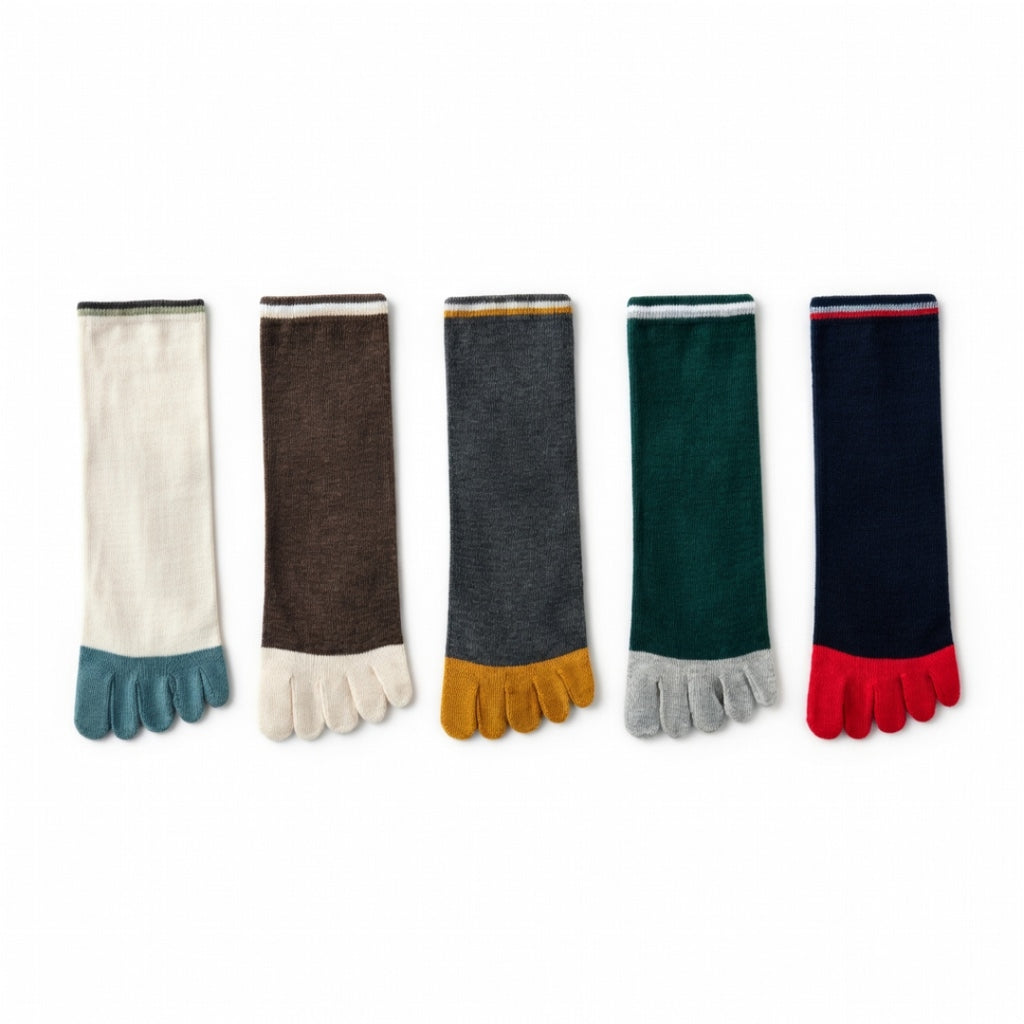 Five toe socks arranged in a row on a white background, featuring different color combinations: off-white with teal, dark brown with off-white, charcoal gray with mustard yellow, dark green with light gray, and navy blue with red.