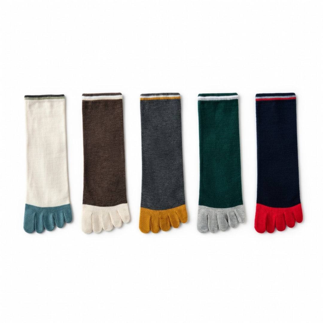 Five toe socks arranged in a row on a white background, featuring different color combinations: off-white with teal, dark brown with off-white, charcoal gray with mustard yellow, dark green with light gray, and navy blue with red.