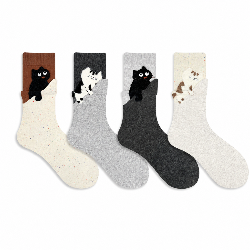 Four pairs of socks with cat designs on a white background