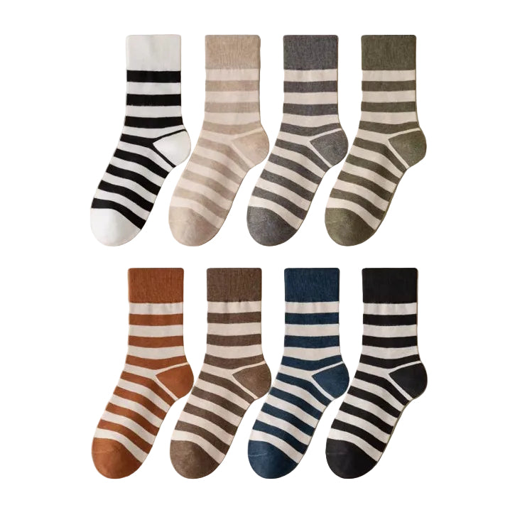 Six pairs of striped crew socks arranged in two rows on awhite background. The socks feature horizontal stripes in various color combinations including black and white, beige and gray, olive green and gray, rust orange and white, brown and beige, and navy blue and white.