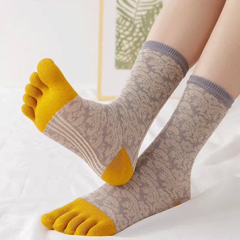 Five-finger socks with yellow toes on a white background