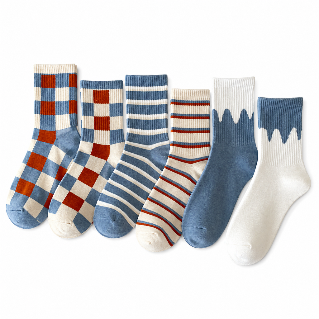 Six pairs of ankle socks arranged in a row on a white background, featuring various patterns including blue and red checkered, striped, and solid colors.