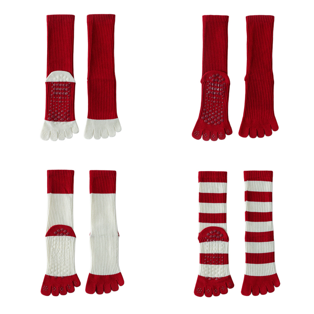 Collection of red and white toe socks on a white background