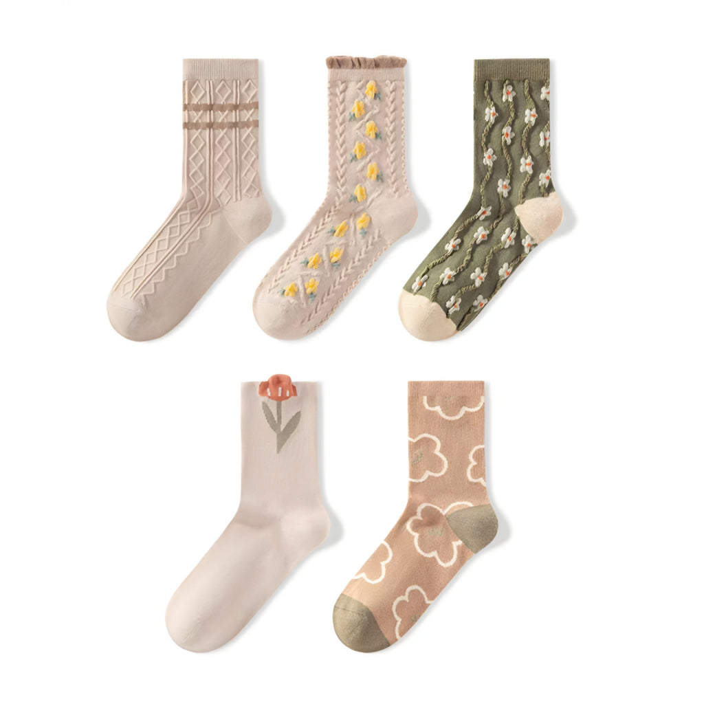 Five pairs of women's crew socks arranged on a white background, featuring neutral and earthy tones with various patterns including cable knit, floral, and cloud motifs.