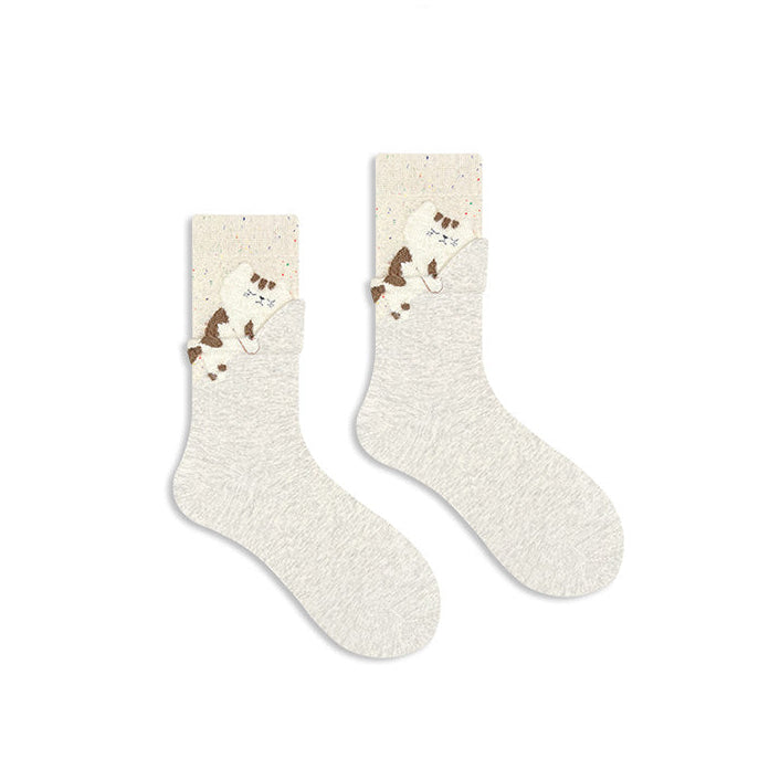 Pair of socks with cartoon characters on a beige background