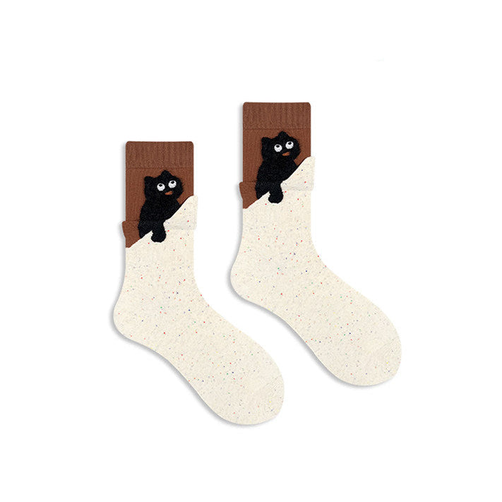 Pair of socks with black cat design on a white background
