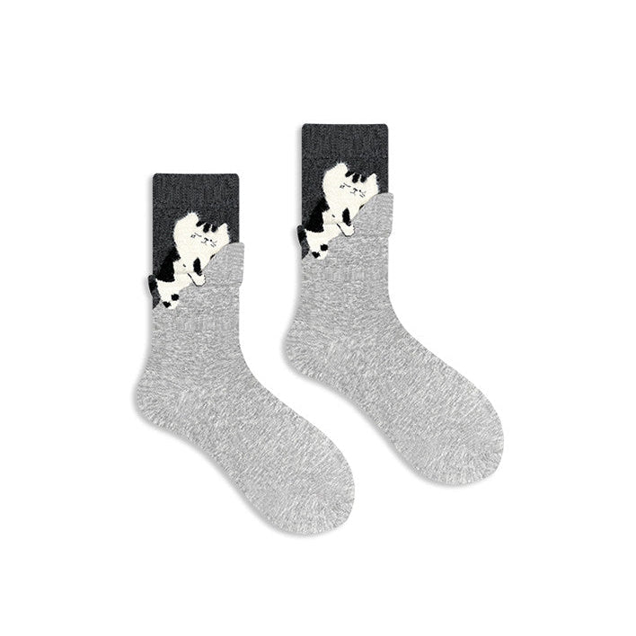Gray socks with cat design on a white background