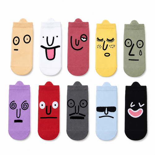 Set of colorful socks with cartoon face designs on a white background