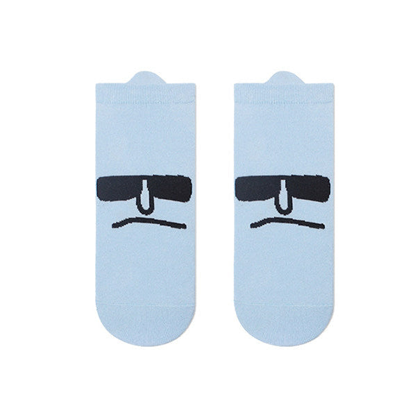 Light blue socks with black sunglasses design on a white background