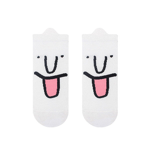Pair of socks with a smiley face design on a white background
