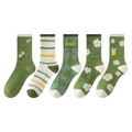 Five pairs of green patterned crew socks displayed side by side on a plain white background. The socks feature various designs including floral prints, stripes, argyle, and bunnies.