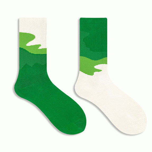 Green and white socks on a white background