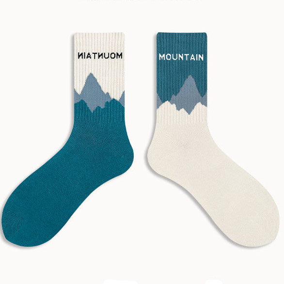Two socks with mountain design on a white background