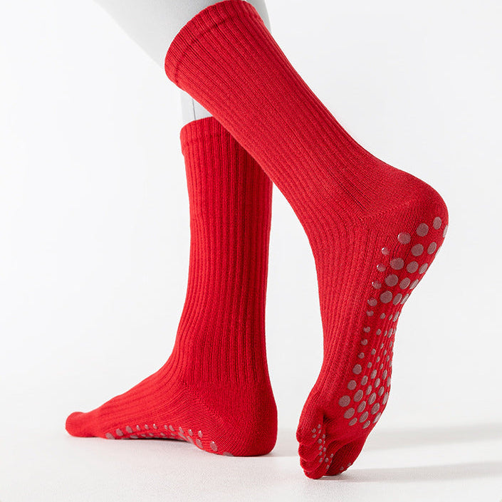 Red socks with non-slip sole on a white background