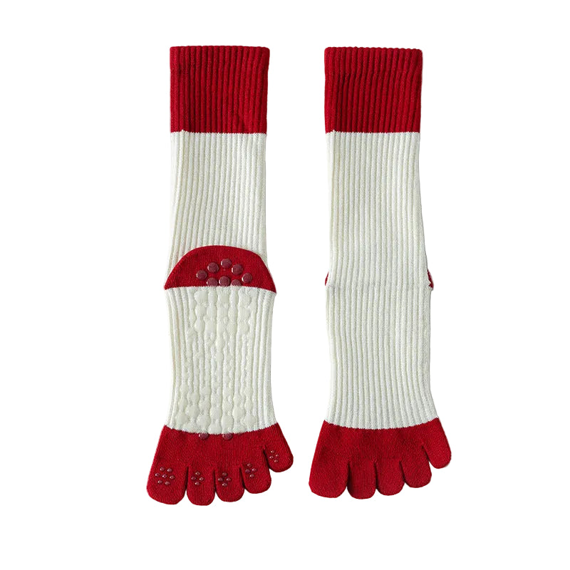 Red and white five-toe socks on a light gray background