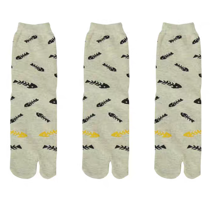 Three pairs of socks with leaf patterns on a white background