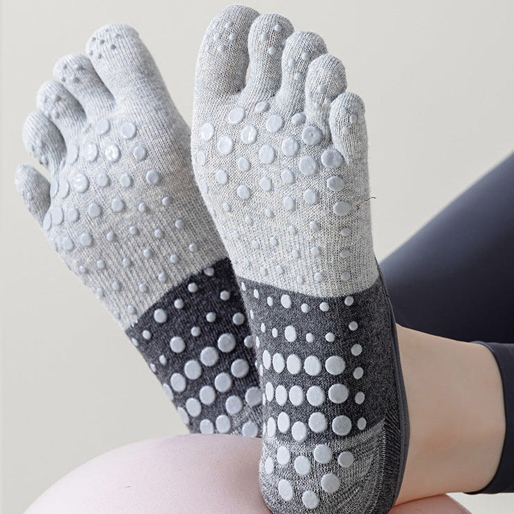 Gray socks with textured sole on a white background